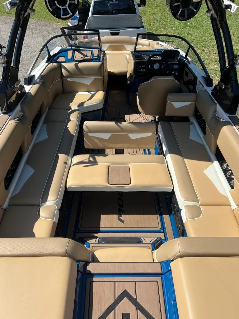 Slide: The Image of 2021 Moomba Makai boat interior with tan seating and modern design. - 12