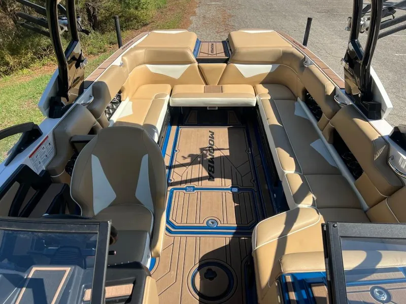 Slide: The Image of 2021 Moomba Makai boat interior with tan seating and modern design. - 16
