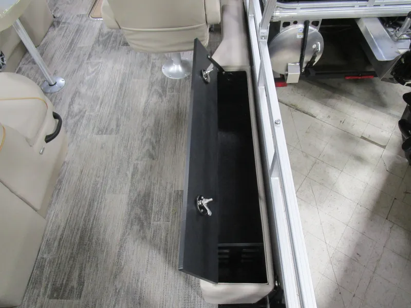 Slide: The Image of Interior of 2025 Ranger 223 FC boat with open storage compartment. - 12
