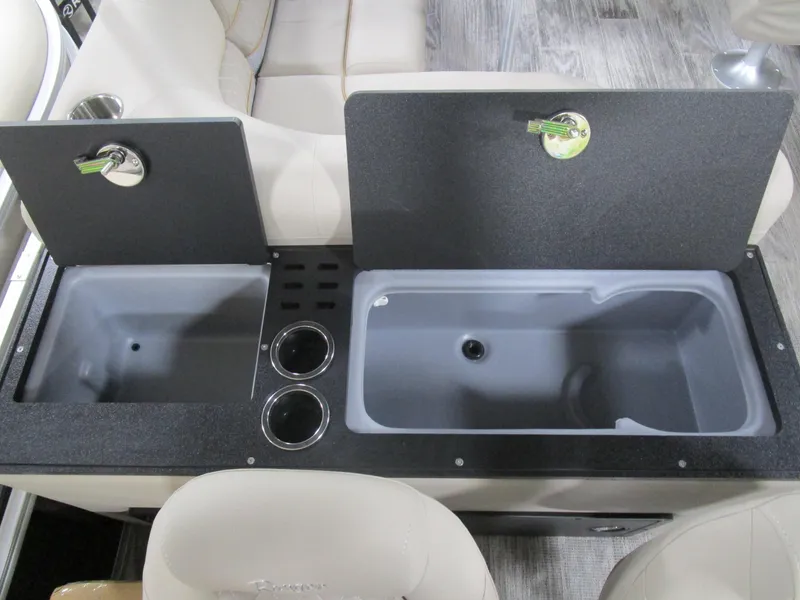 Slide: The Image of 2025 Ranger 223 FC boat interior with dual sink setup and cup holders. - 14