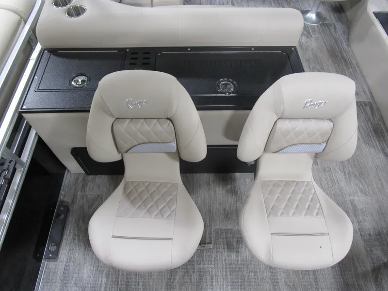 Slide: The Image of Two beige seats in a 2025 Ranger 223 FC boat interior. - 15