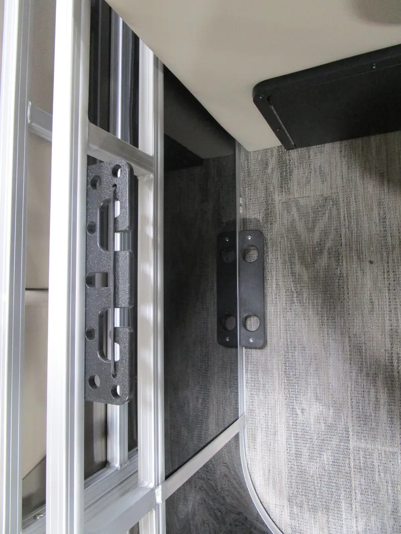 Slide: The Image of Interior view of 2025 Ranger 223 FC boat, featuring sleek metal and wood finishes. - 16