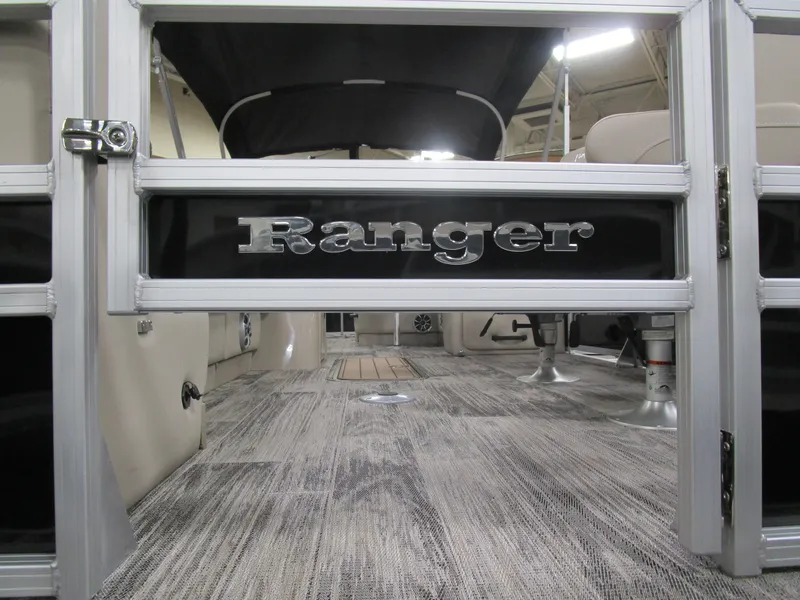 Slide: The Image of 2025 Ranger 223 FC boat interior with stylish flooring and seating. - 19