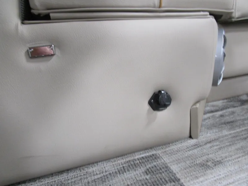 Slide: The Image of Beige interior detail of 2025 Ranger 223 FC boat, featuring a control knob. - 3