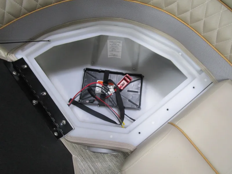 Slide: The Image of Battery compartment of 2025 Ranger 223 FC boat with wiring and secure straps. - 5