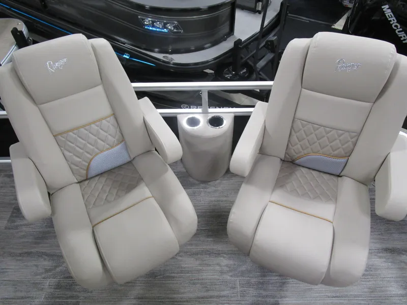 Slide: The Image of Luxurious seating on 2025 Ranger 223 FC boat with quilted design and cup holders. - 6
