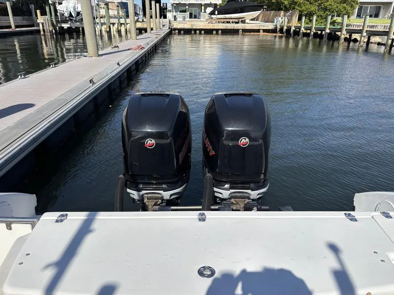 Slide: The Image of Twin outboard engines on a 2008 Fountain 33 Sportfish Cruiser at a marina dock. - 10