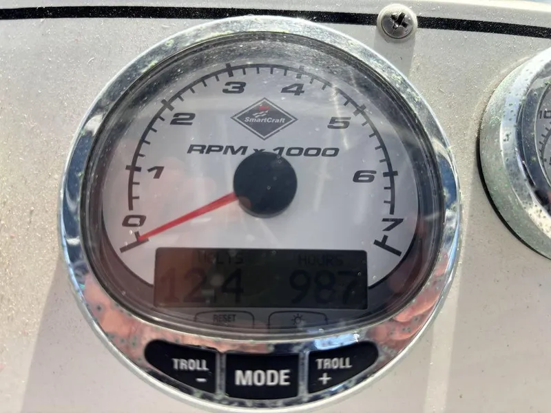 Slide: The Image of Close-up of a 2008 Fountain 33 Sportfish Cruiser tachometer displaying RPM and hours. - 24
