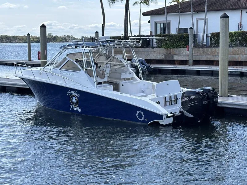 Slide: The Image of 2008 Fountain 33 Sportfish Cruiser docked with twin Mercury engines. - 28