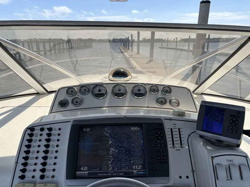 Slide: The Image of 2008 Fountain 33 Sportfish Cruiser dashboard with navigation equipment and waterway view. - 3