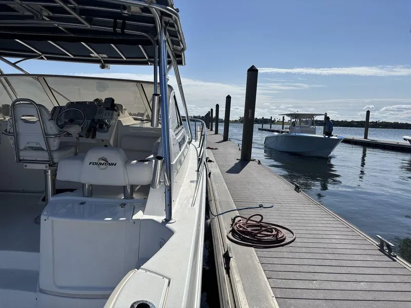 Slide: The Image of 2008 Fountain 33 Sportfish Cruiser docked at marina under clear blue sky. - 8