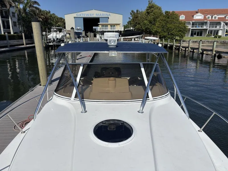 Slide: The Image of 2008 Fountain 33 Sportfish Cruiser docked at marina with clear blue sky. - 9