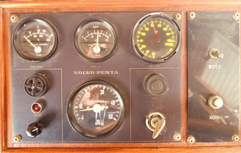 Slide: The Image of 1980 C & L Sea Ranger dashboard with Volvo Penta gauges and controls. - 21
