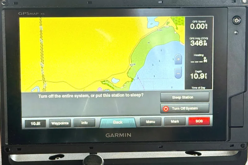Slide: The Image of Garmin GPS display on 1980 C & L Sea Ranger, showing navigation map and system options. - 23