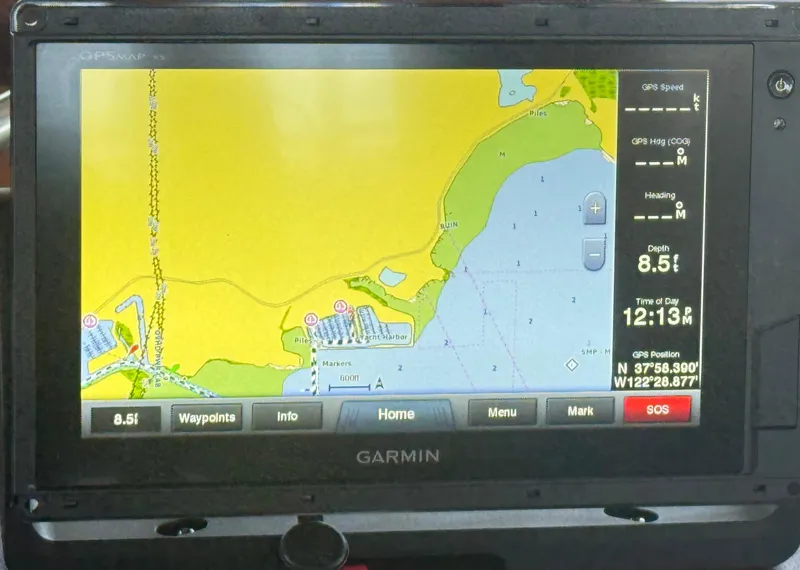 Slide: The Image of Garmin GPS display on 1980 C & L Sea Ranger, showing nautical map and coordinates. - 24