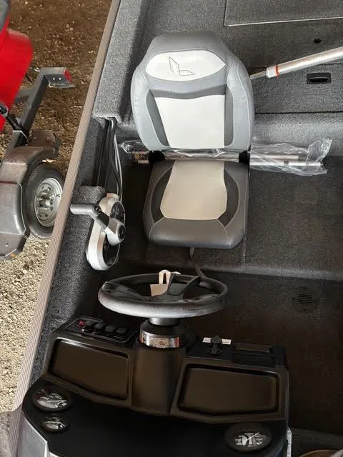 Slide: The Image of 2025 Lowe Skorpion 16 boat interior with steering wheel and seat. - 15