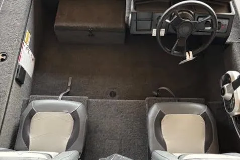 Slide: The Image of 2025 Lowe Skorpion 16 boat interior with dual seats and steering wheel. - 20