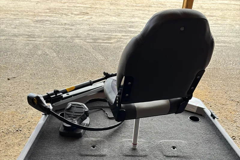 Slide: The Image of 2025 Lowe Skorpion 16 boat seat and trolling motor on deck. - 7
