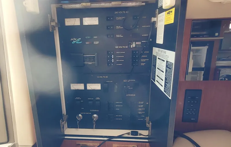 Slide: The Image of Electrical panel inside a 1998 Sea Ray 450 Sundancer yacht. - 19