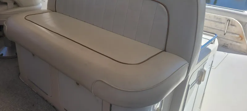 Slide: The Image of 1998 Sea Ray 450 Sundancer interior seating, white leather upholstery, elegant and spacious design. - 38