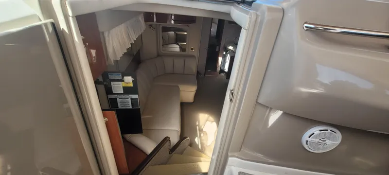 Slide: The Image of Interior view of 1998 Sea Ray 450 Sundancer yacht, featuring a cozy seating area. - 45