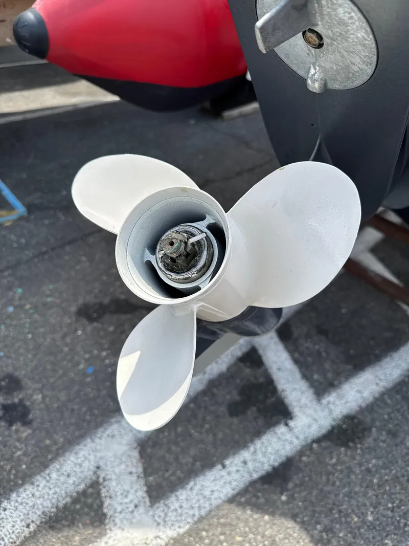 Slide: The Image of Close-up of a Zodiac Bayrunner 500 boat propeller, 2019 model, on a paved surface. - 8