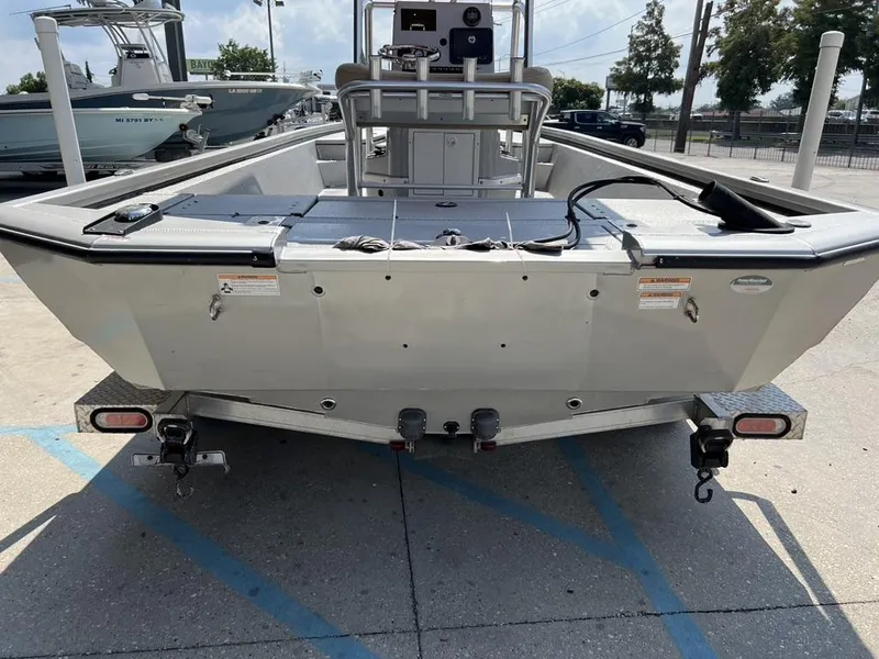 Slide: The Image of 2020 Avid 23 FS Platinum boat on trailer, rear view in parking lot. - 4