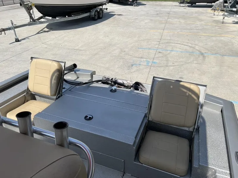 Slide: The Image of 2020 Avid 23 FS Platinum boat interior with beige seats and control panel. - 5