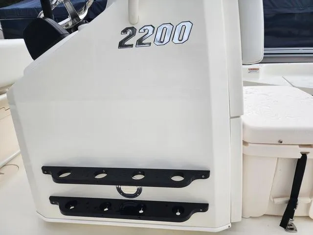 Slide: The Image of 2024 Pathfinder 2200 TRS boat console with rod holders and storage. - 16