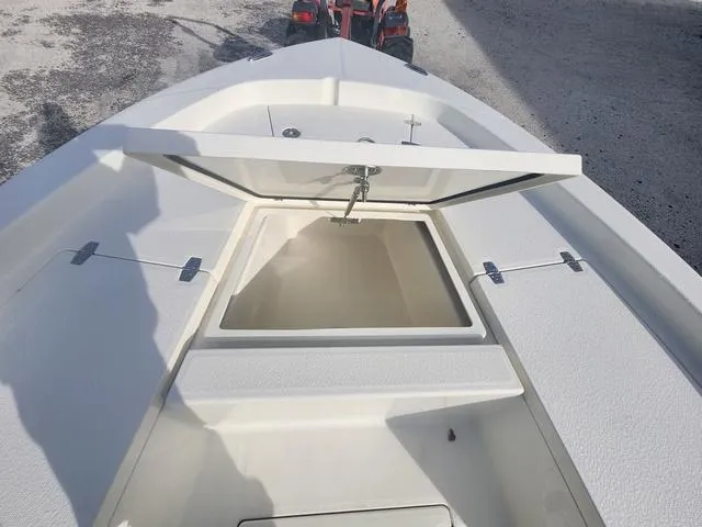 Slide: The Image of 2024 Pathfinder 2200 TRS boat with open storage compartment on deck. - 33