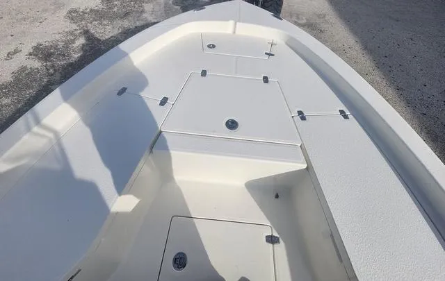 Slide: The Image of 2024 Pathfinder 2200 TRS boat deck, featuring storage compartments and sleek design. - 35