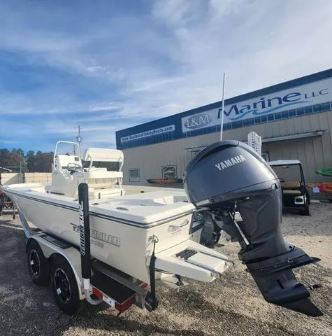 Slide: The Image of 2024 Pathfinder 2200 TRS boat with Yamaha engine at L&M Marine dealership. - 49