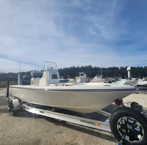Slide: The Image of 2024 Pathfinder 2200 TRS boat on trailer under clear sky. - 5