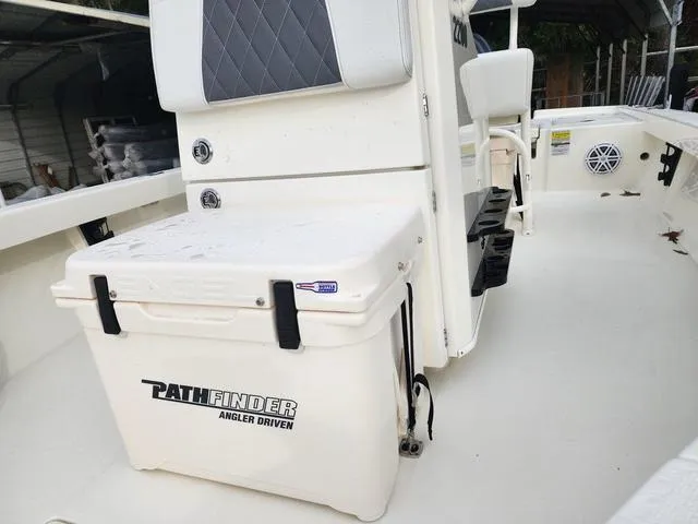 Slide: The Image of 2024 Pathfinder 2200 TRS boat interior with seating and storage. - 8