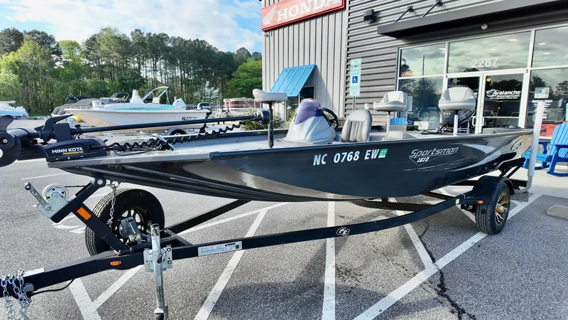 Slide: The Image of 2021 G3 Sportsman 1610 boat on trailer outside dealership. - 2