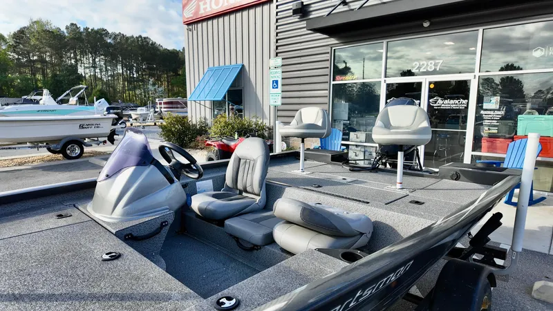 Slide: The Image of 2021 G3 Sportsman 1610 boat with seating, parked outside dealership. - 3