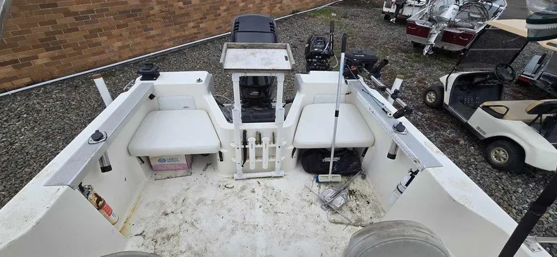 Slide: The Image of 2006 Bayliner Trophy 1802 WA boat interior with seating and equipment. - 2