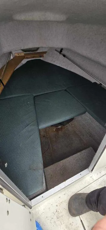 Slide: The Image of 2006 Bayliner Trophy 1802 WA cabin interior with cushioned seating. - 5