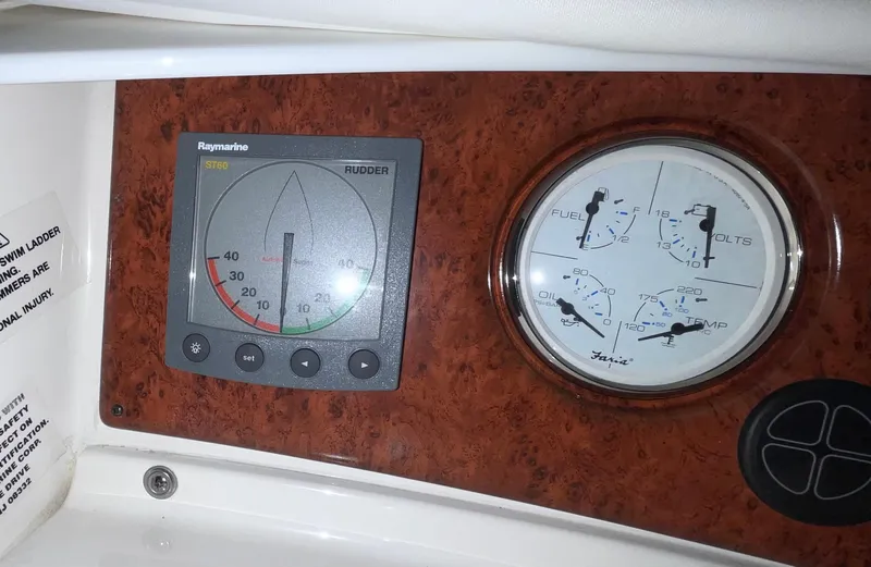 Slide: The Image of Control panel of a 2005 Silverton 35 Motor Yacht with gauges and indicators. - 16