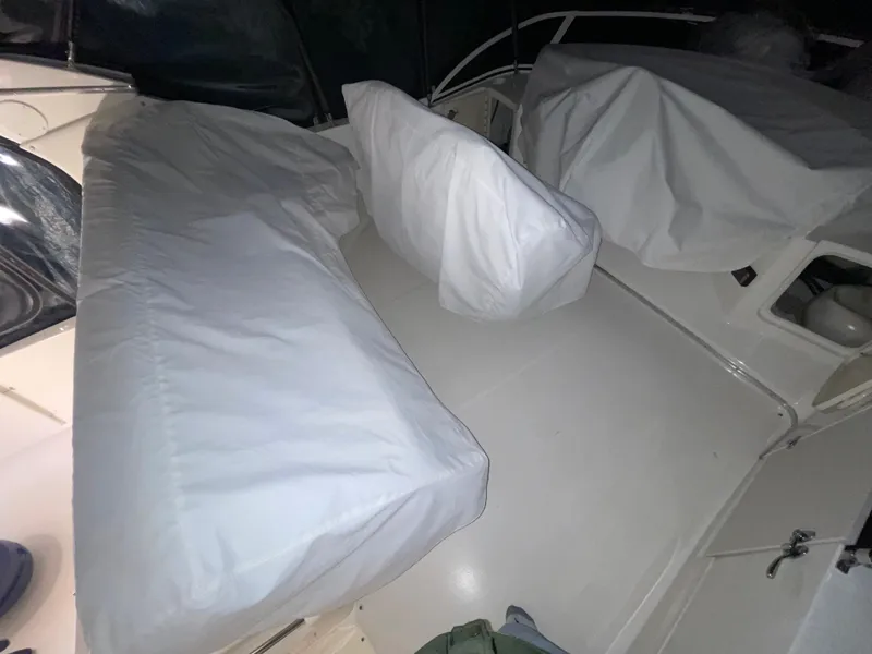 Slide: The Image of 2005 Silverton 35 Motor Yacht interior with covered seating area. - 18