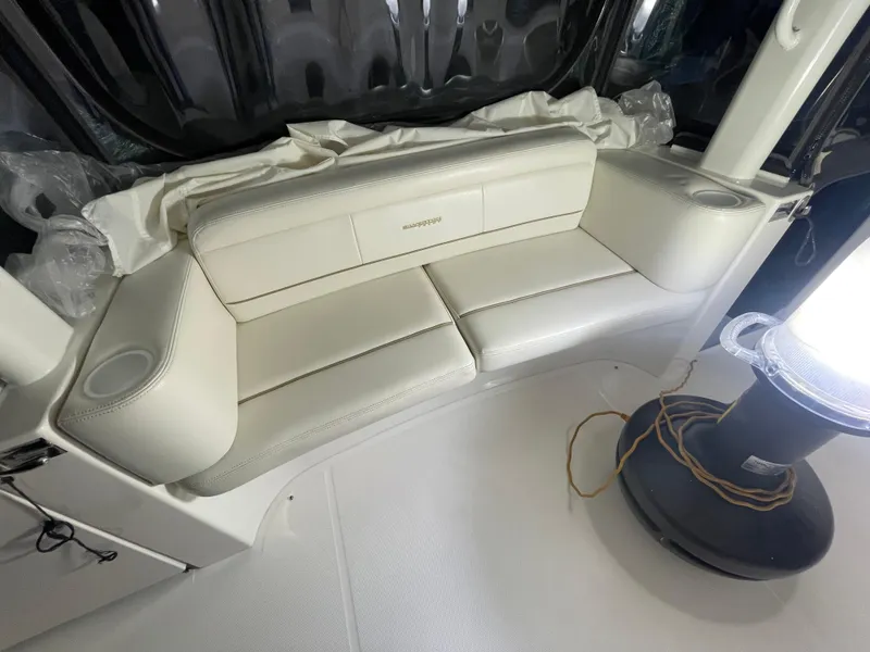 Slide: The Image of 2005 Silverton 35 Motor Yacht interior with white leather seating and ambient lighting. - 21
