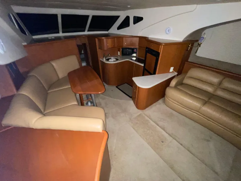 Slide: The Image of Interior of 2005 Silverton 35 Motor Yacht with seating and kitchenette. - 26