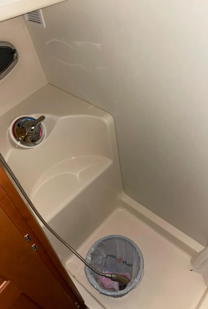 Slide: The Image of 2005 Silverton 35 Motor Yacht bathroom with sink and shower area. - 33