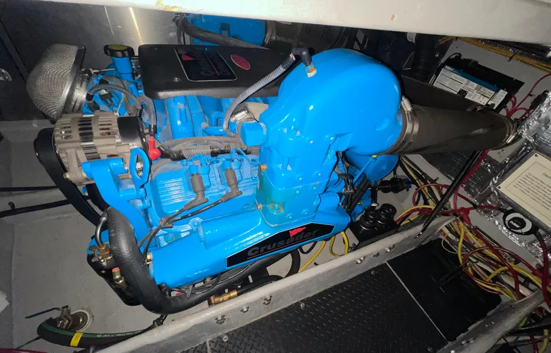 Slide: The Image of Engine of 2005 Silverton 35 Motor Yacht, featuring a blue Crusader engine. - 37