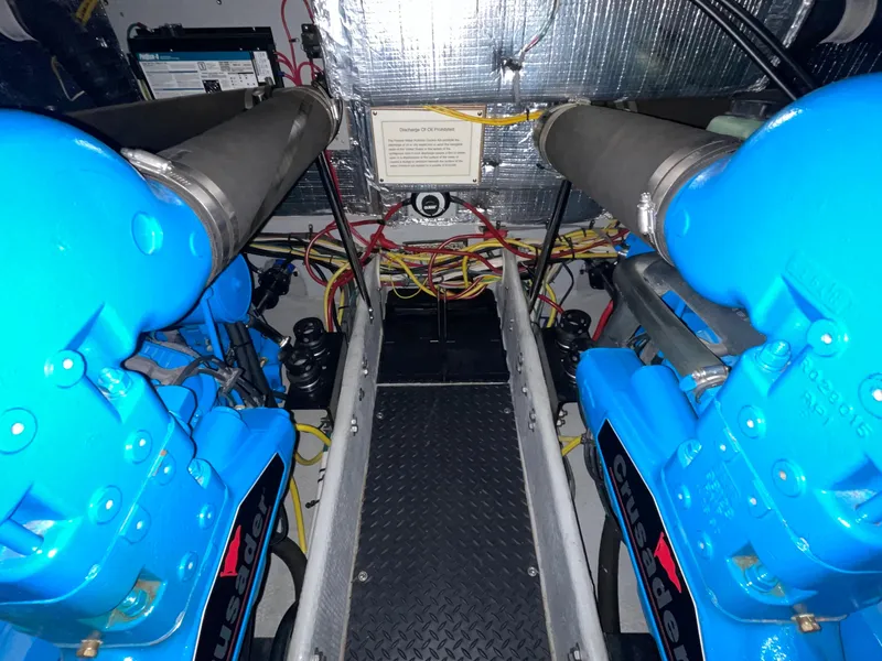 Slide: The Image of Engine room of a 2005 Silverton 35 Motor Yacht with blue Crusader engines. - 38
