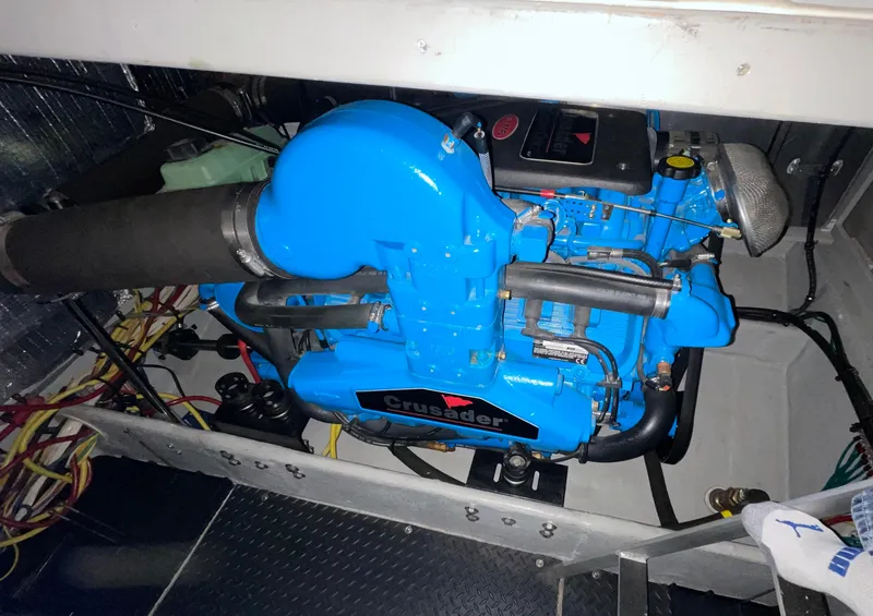 Slide: The Image of Engine compartment of a 2005 Silverton 35 Motor Yacht with a blue Crusader engine. - 39