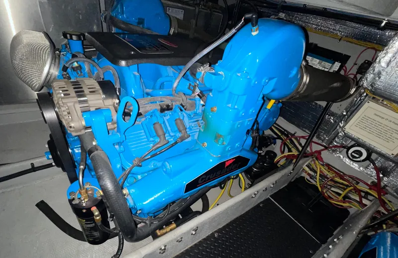 Slide: The Image of Engine of 2005 Silverton 35 Motor Yacht, featuring a Crusader engine in a well-maintained compartment. - 41