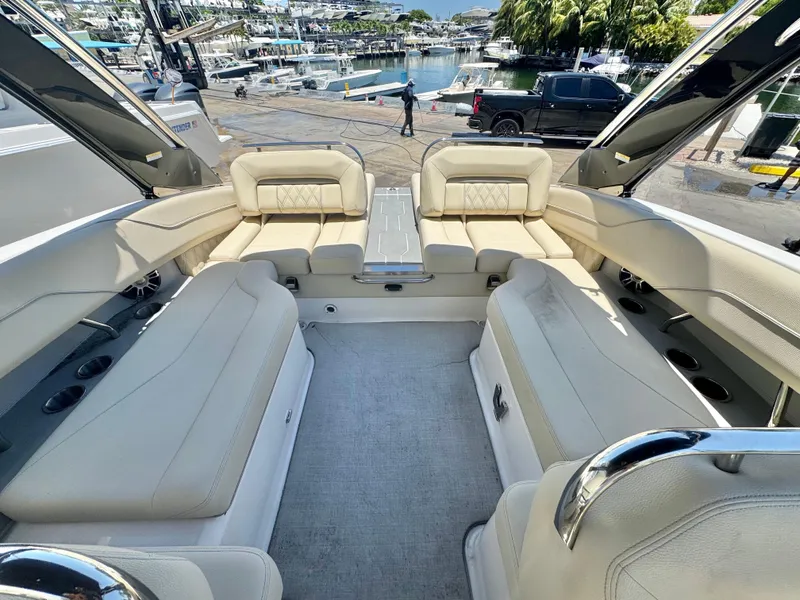 Slide: The Image of Luxurious interior of a 2020 Regal LS4 boat docked at a marina. - 12
