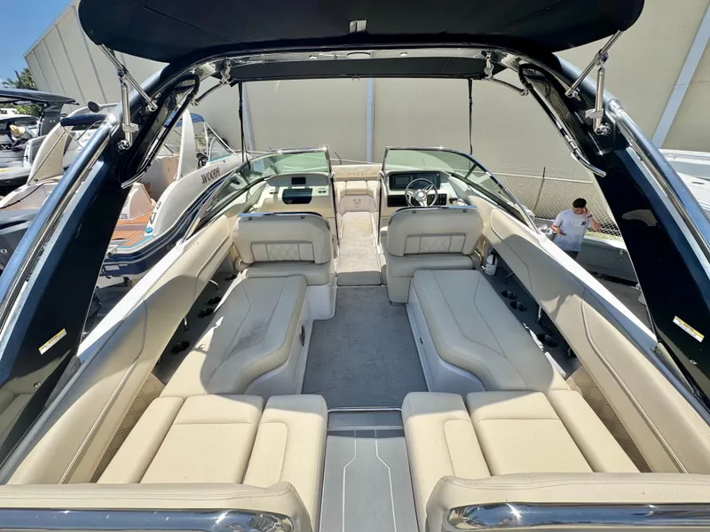 Slide: The Image of 2020 Regal LS4 boat interior with beige seating and sleek design. - 13