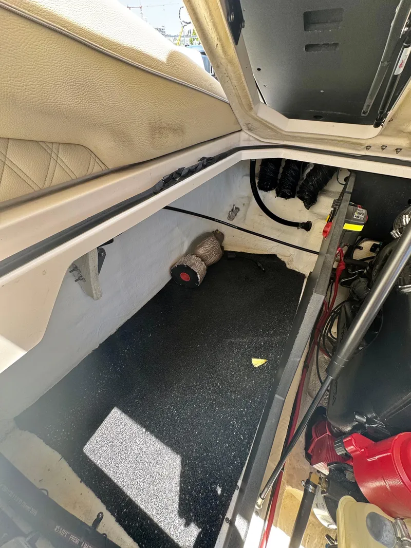 Slide: The Image of Interior view of a 2020 Regal LS4 boat storage compartment with visible wiring and components. - 17